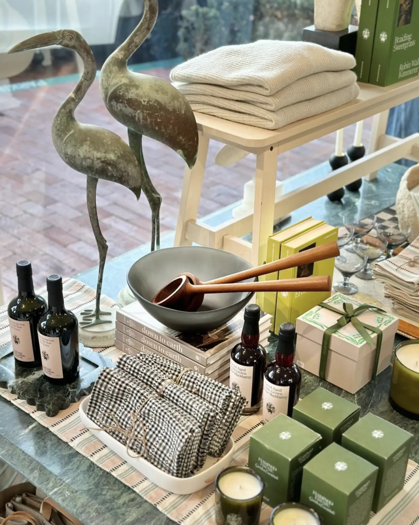 Olive oil, candles and homewares on a table at Alchemy Works