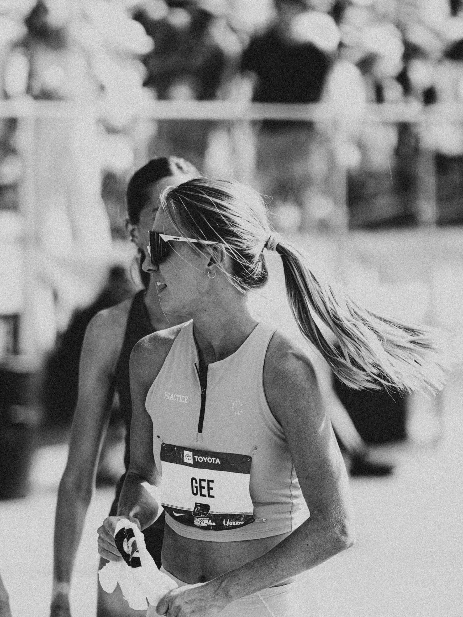 A runner in a race, in black and white, Currently Running