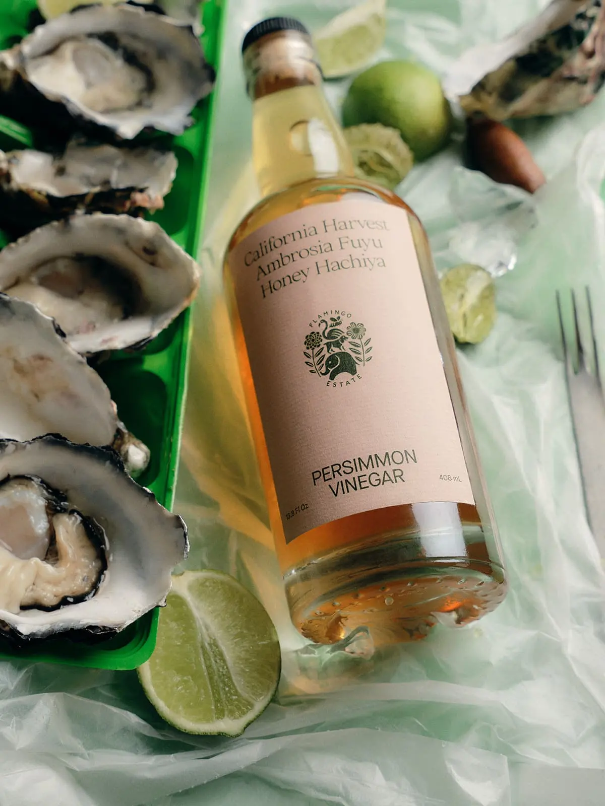 A Flamingo Estate bottle with oysters and limes