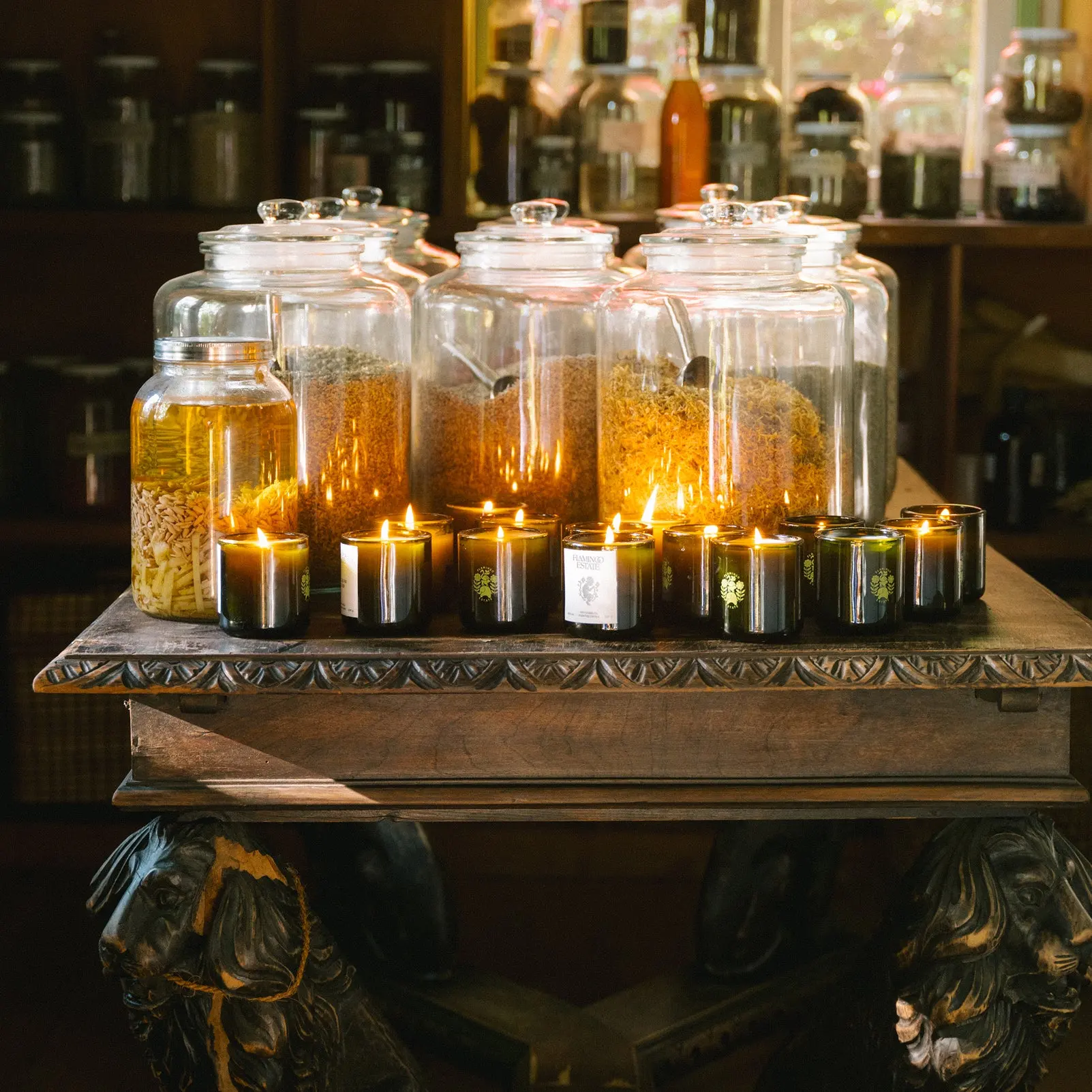 Candles among apothecary jars at Flamingo Estate
