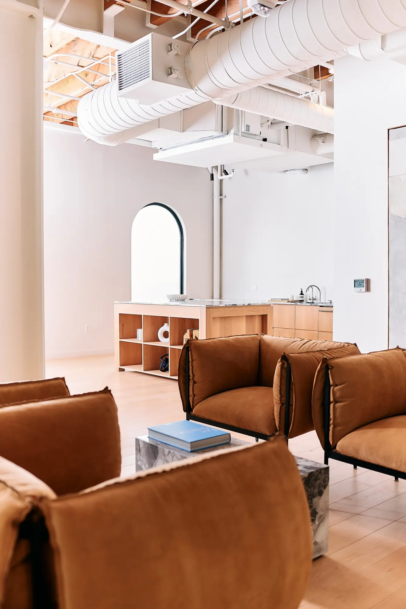 Tan leather armchairs in the Greycroft office at Signal