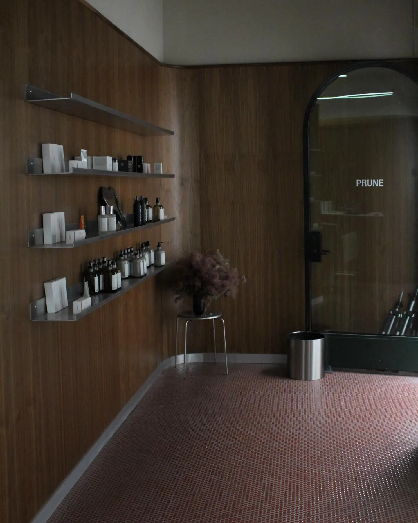 Wood walls and product shelves in the Prune hair studio at Signal