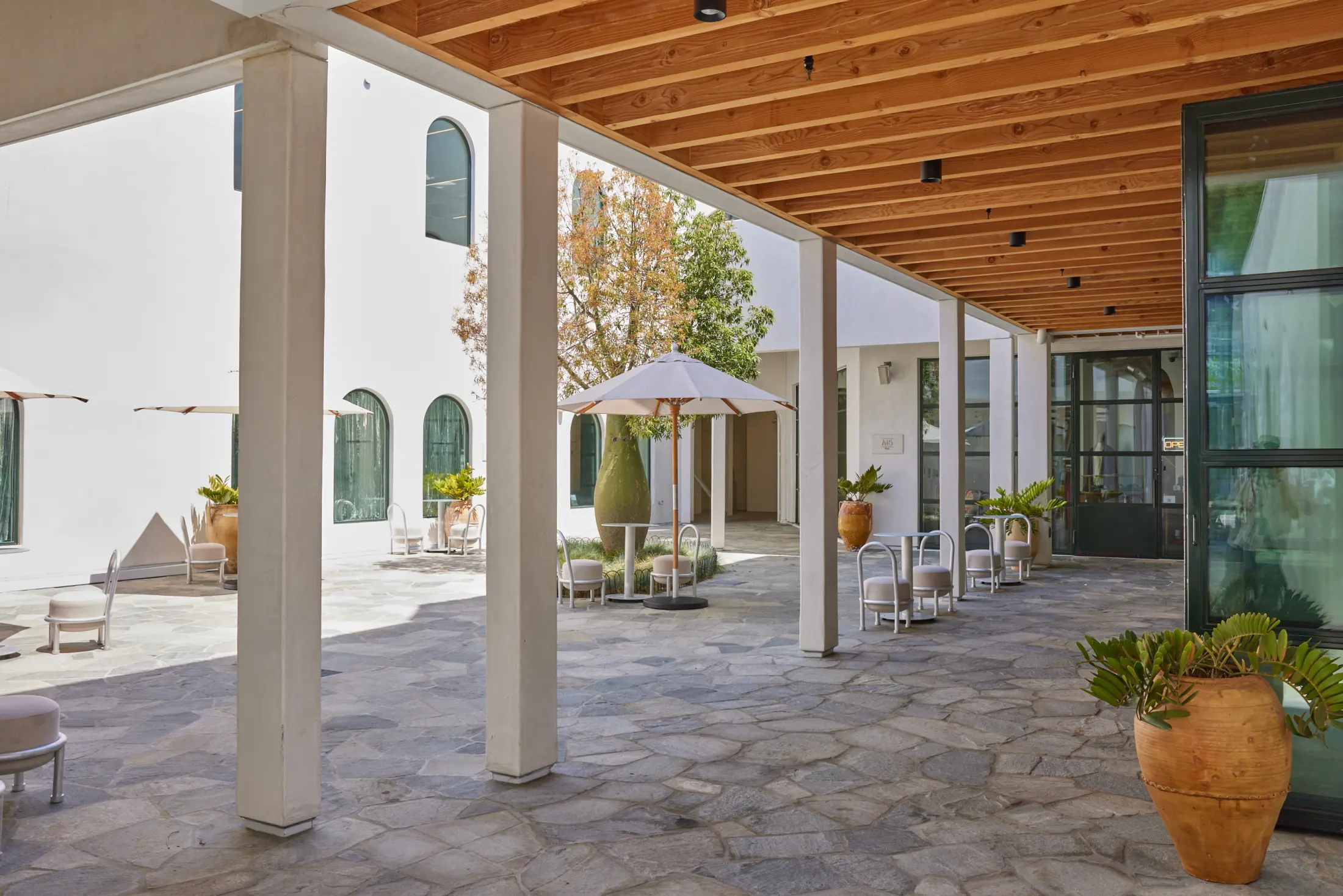 The arcade and umbrellas in the courtyard at Signal