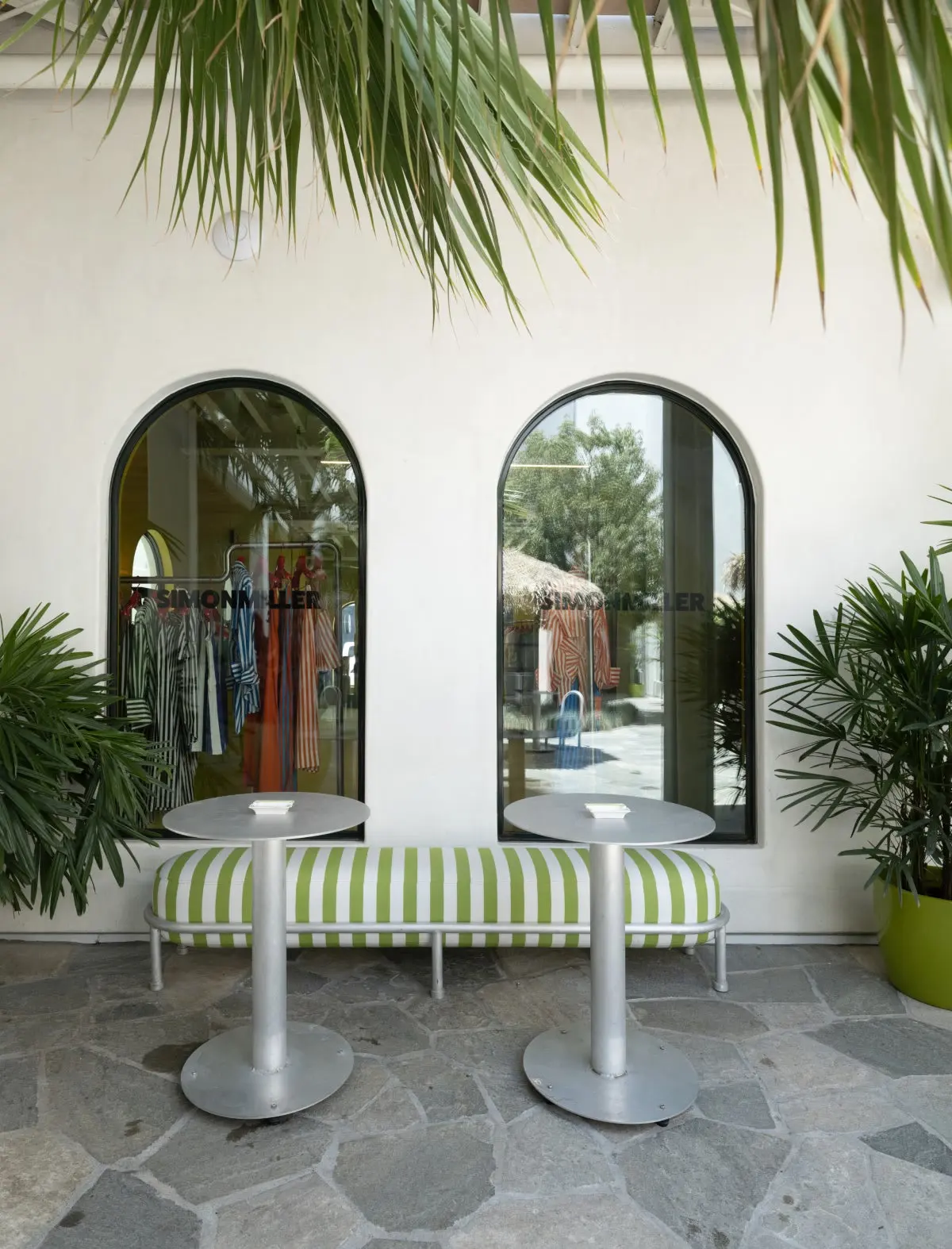 Arched windows and a striped bench outside the Simon Miller store at Signal